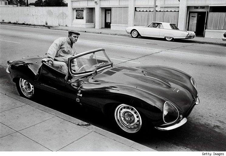 Steve McQueen hopping in his Jaguar XKSS-- 1963.