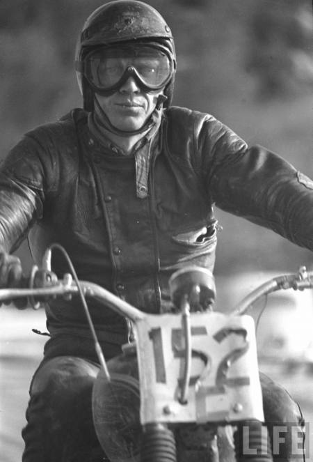 Actor Steve McQueen on motorbike during 500-mi. race across Mojave Desert.