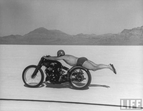 Roland Free breaking world's speed record on Bonneville Salt Flats while laying on his bike  --September, 1948.