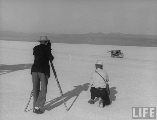 Roland Free breaking world's speed record on Bonneville Salt Flats while photographers try to snap pictures  --September, 1948.