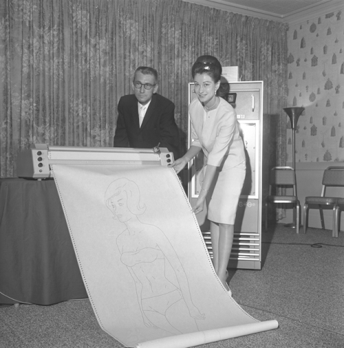 PERFECTION?-James L. Pyle and Nonna Walls examine "Miss Formula", a computer-created drawing resulting from a list of "perfect female" statistics, CA 1964. 